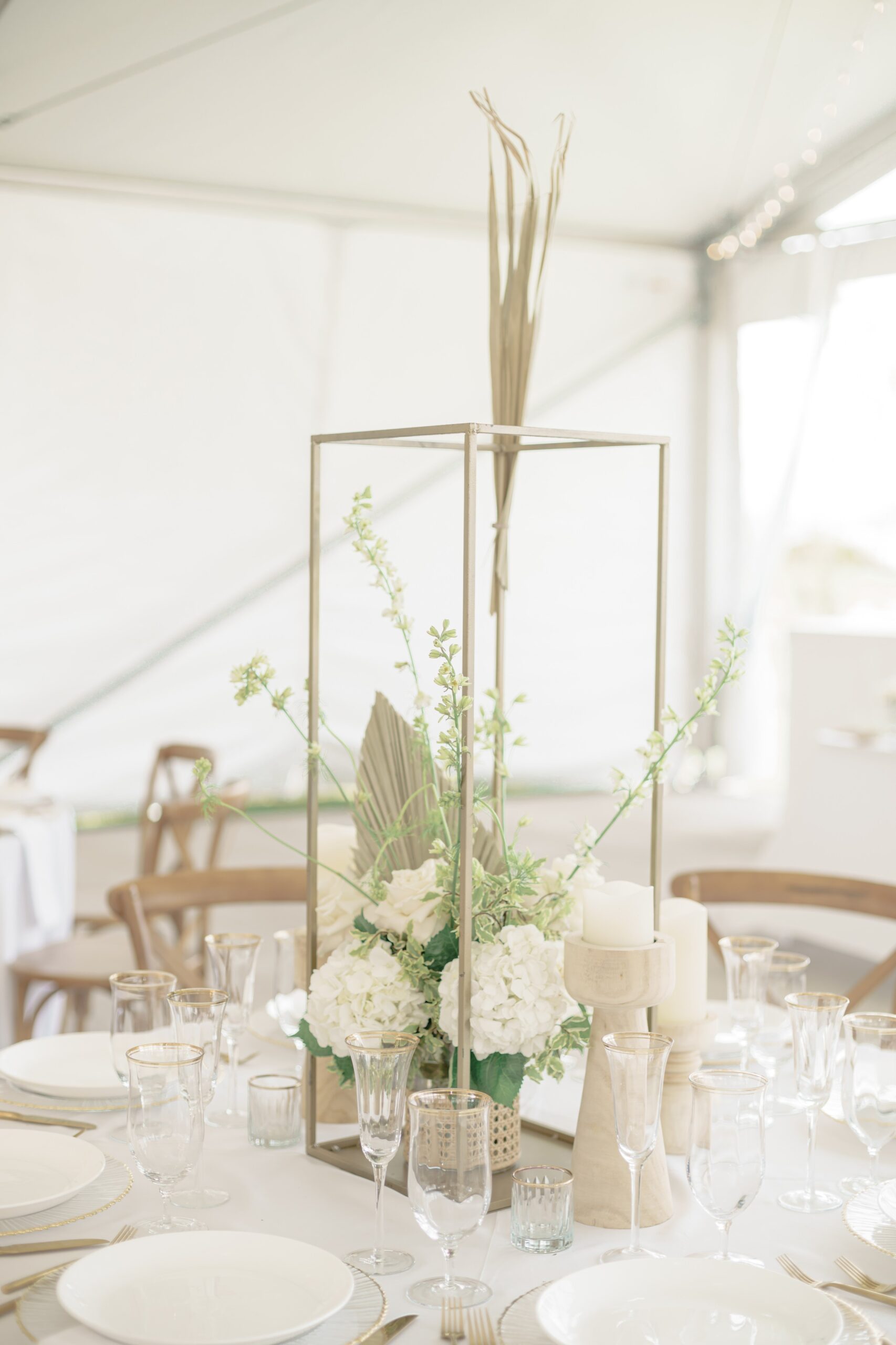 Outdoor white wedding with green floral accents